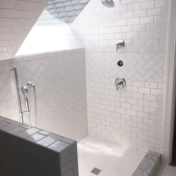 Erskin's Tile - a bathroom with a skylight - Flooring Near Me