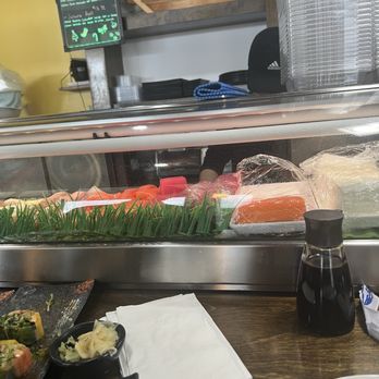 Royal Sushi - Chef is in upper right hand corner hiding behind the plastic containers. I wanted to show both ears with pods & ignoring us. - Sushi Bars Near Me - Edgewater, Florida Royal Sushi - Chef is in upper right hand corner hiding behind the plastic containers. I wanted to show both ears with pods & ignoring us. - Sushi Bars Near Me - Edgewater, Florida
