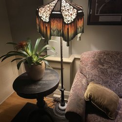 McMenamins Grand Lodge - There is seating all around the building with beautiful antique lamps.