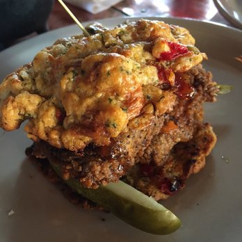 Flatiron Restaurant & Bar - Spicy chicken w/ pimento cheese biscuit, candied bacon and pickles - Burgers Near Me - Atlanta, Georgia