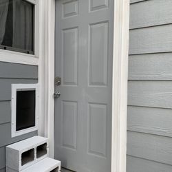 Handyman Connection of Parker - Dog door install with simple cider block steps.