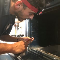 Best Price Appliance Repair & HVAC - One of our lead technicians replacing an ignitor in an oven