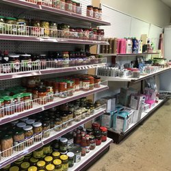 European Grocery Store - Canned goods: vegetables, peppers, tomato sauces, cleaners, soaps, tea sets and kettles.