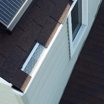 All American Gutter Protection - Shingles laying on top of the gutters. Missing a shingle because they ripped the shingles up away from the house to install - Gutter Services Near Me - North Canton, Ohio