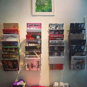 Honey Moon Coffee Shop - a display of magazines and coffee cups - Coffee & Tea Near Me - Ridgewood, New York