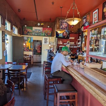 Mario's Bohemian Cafe - a man sitting at the bar - Italian Near Me - San Francisco, California Mario's Bohemian Cafe - a man sitting at the bar - Italian Near Me - San Francisco, California