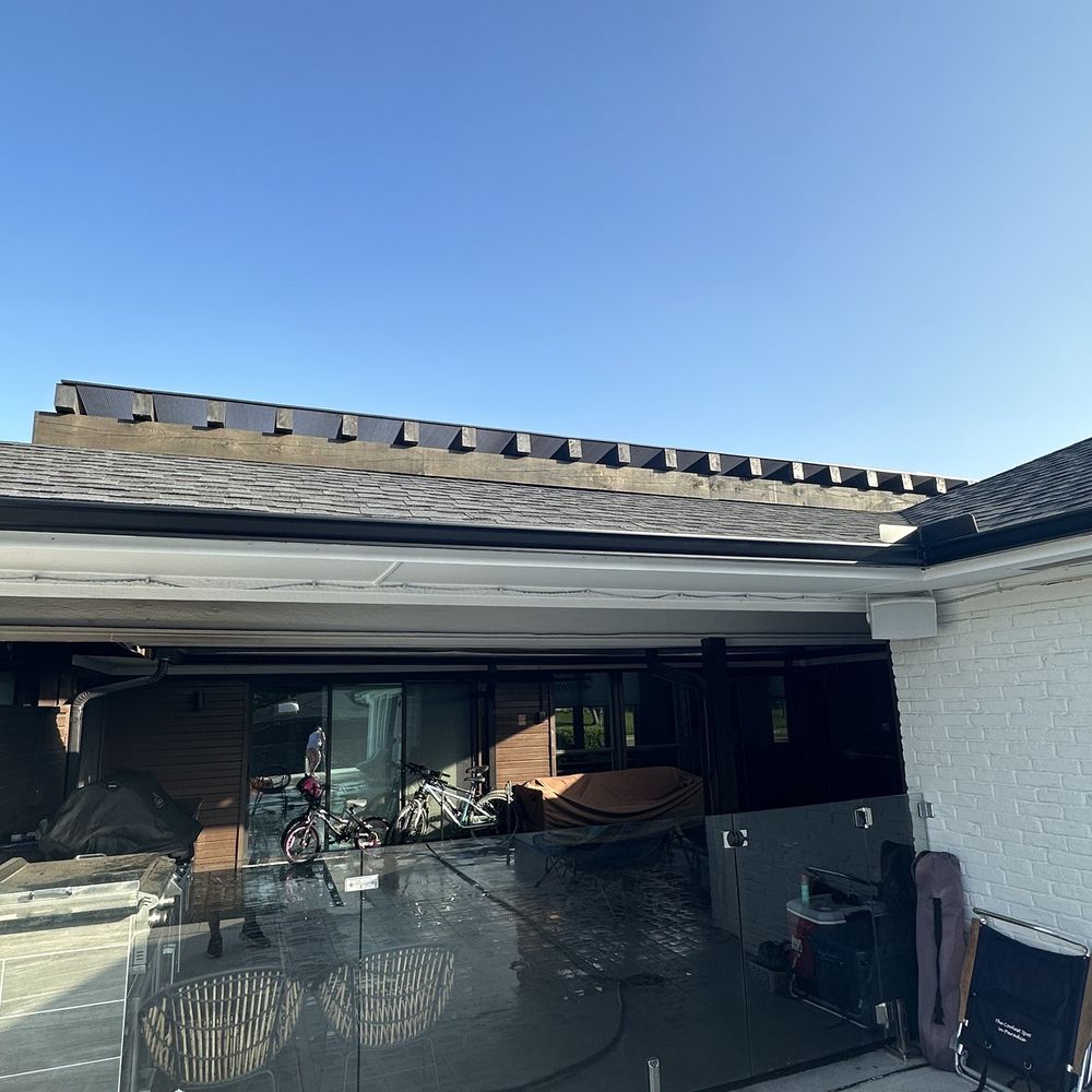 Pergola with skyjacks and bronze poly carbonate.