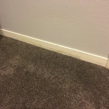 Valley Floors - the corner of a room with a carpeted floor - Carpet Installation Near Me Valley Floors - the corner of a room with a carpeted floor - Carpet Installation Near Me