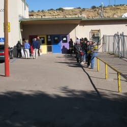 Crownpoint Navajo Rug Auction - Weavers and potential bidders waiting to enter the Crownpoint Elementary School