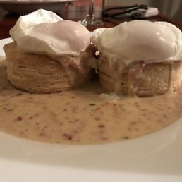 Photo of Capitalist Pig - Saint Louis, MO, United States. The poached eggs and burnt ends gravy could not save this dish...those biscuits were hard, dry, and inedible.