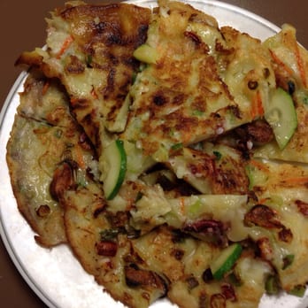 NY Korean BBQ - Seafood pancake - Hae Mul Pa Jun - morsels of squid, shrimp and mussel bound by chewy batter, crispy in all the right spots. - Delis Near Me - Westfield, New Jersey NY Korean BBQ - Seafood pancake - Hae Mul Pa Jun - morsels of squid, shrimp and mussel bound by chewy batter, crispy in all the right spots. - Delis Near Me - Westfield, New Jersey