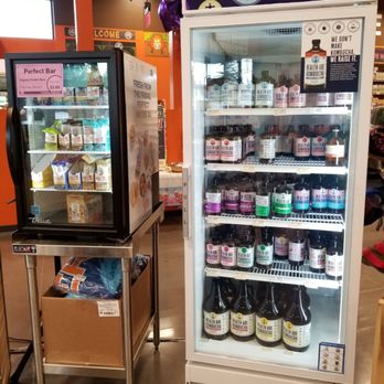 Natural Grocers - Refrigerator stocked with Kombucha on impulse checkout aisle. - Organic Stores Near Me - Portland, Oregon