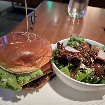 Earls Kitchen + Bar - Earls The Stack Burger with salad - New American Near Me - Bellevue, Washington