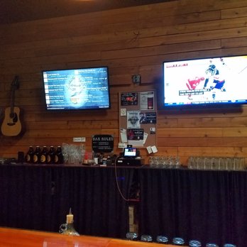 Dreadnought Brewing - Digital brew display & TV behind the bar. - Breweries Near Me - Monroe, Washington Dreadnought Brewing - Digital brew display & TV behind the bar. - Breweries Near Me - Monroe, Washington