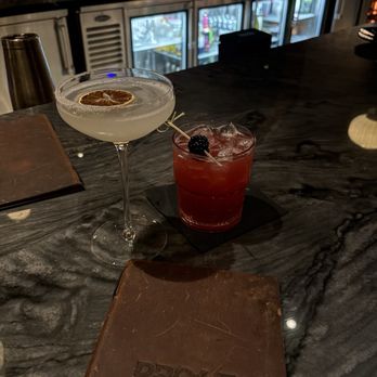 Proof Kitchen and Bar - Lavender lemon drop martini (left) blackberry sage smash (right) - Diners Near Me - Manassas, Virginia Proof Kitchen and Bar - Lavender lemon drop martini (left) blackberry sage smash (right) - Diners Near Me - Manassas, Virginia