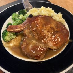 Huge pork chop delicious gravy with mashed and broccoli. Delicious and reasonably priced!