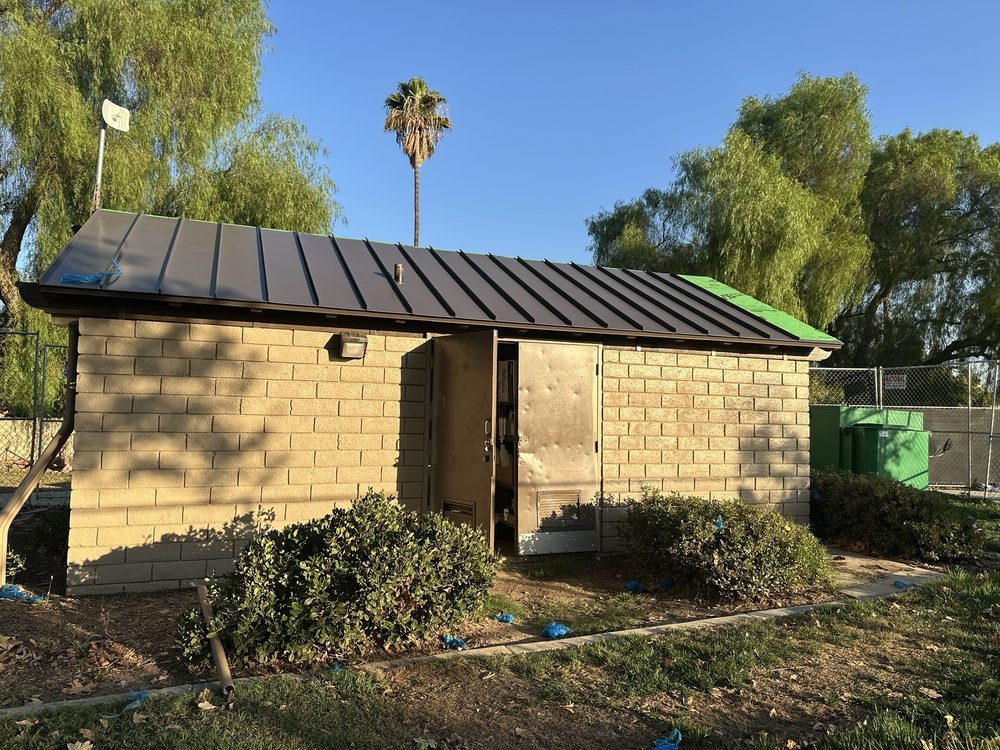 Slide of T’s Roofing 