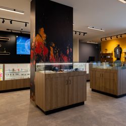 Artwork on the support wall inside Oxnard Holistics stands out among the variety of products in display cases