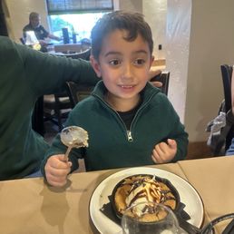 A happy boy with his cookie dessert! A happy boy with his cookie dessert!