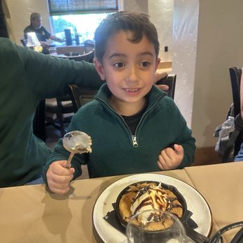 Toscana's Ristorante - A happy boy with his cookie dessert! - Italian Near Me - Turlock, California Toscana's Ristorante - A happy boy with his cookie dessert! - Italian Near Me - Turlock, California