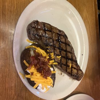 Texas Roadhouse - New York Strip* 12 oz with Baked Potato loaded - Steakhouses Near Me - Florida City, Florida Texas Roadhouse - New York Strip* 12 oz with Baked Potato loaded - Steakhouses Near Me - Florida City, Florida