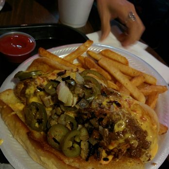 Lebowski's Grill - The Donny... A bacon wrapped, battered and deep fried hot dog covered in chili with jalapenos on a butter toasted hoagie - Burgers Near Me - Austin, Texas Lebowski's Grill - The Donny... A bacon wrapped, battered and deep fried hot dog covered in chili with jalapenos on a butter toasted hoagie - Burgers Near Me - Austin, Texas