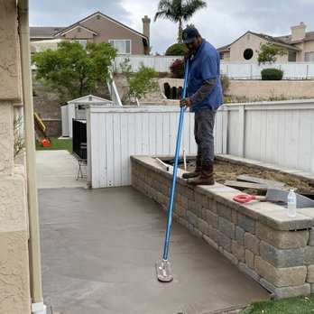 Ochoa Concrete - Alex working his magic on the concrete that was put down. - Landscaping Near Me Ochoa Concrete - Alex working his magic on the concrete that was put down. - Landscaping Near Me