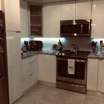 Real Vida Remodeling - Pantry next to refrigerator. A lot of storage in a small space. - General Contractors Near Me