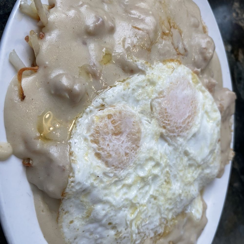 River Rock Cafe - Half and half biscuits and gravy and hash browns and gravy with two eggs over medium. - Cafes Near Me - Riggins, Idaho River Rock Cafe - Half and half biscuits and gravy and hash browns and gravy with two eggs over medium. - Cafes Near Me - Riggins, Idaho