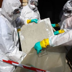 MJT Contracting - Protective equipment and material handling during environmental remediation.