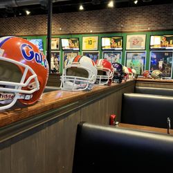 Duffy's Sports Grill - College and Pro helmets on display throughout the restaurant