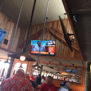 Surf Hut - Two big surf boards watching the bar. - Seafood Near Me - Destin, Florida