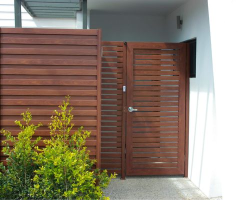 Photo of Defensible Designs - Orinda, CA, US. Sample of "Knotwood" aluminum product on a gate