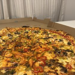 Tony G’s Pizzeria - I can't remember the name of their veggie pizza, but OMG.