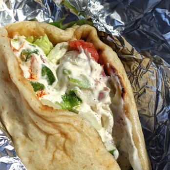 The Halal Guys - Pita wrap with protein, lettuce, tomatoes, onions, white sauce, hot sauce, cilantro and more! (All customizable!!) - Halal Near Me - Glendale, California The Halal Guys - Pita wrap with protein, lettuce, tomatoes, onions, white sauce, hot sauce, cilantro and more! (All customizable!!) - Halal Near Me - Glendale, California