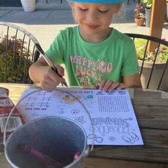 Tasha Lee’s Table - happy coloring her kids menu with a whole bucket of crayons! thank you Tasha! - Steakhouses Near Me - Anacortes, Washington