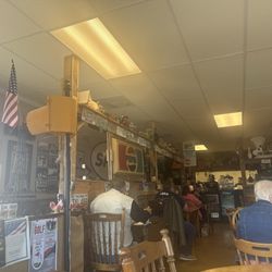 Uncle Billy's Downtown Eatery - In the photos, you will see their hamburgers. They're spinach, chicken salad wraps, and they're berry salad in the window..