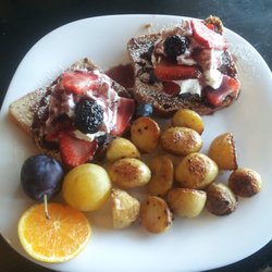 Kim's Cafe - Fruit Fusion French Toast with hash browns, real fruit and real whipped cream. Gluten-free version is still under 10 bucks!