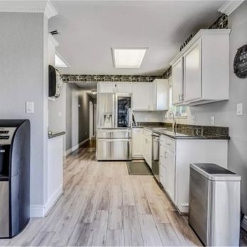 Flooring Liquidators - a kitchen with white cabinets and appliances - Flooring Near Me - Tulare, California Flooring Liquidators - a kitchen with white cabinets and appliances - Flooring Near Me - Tulare, California