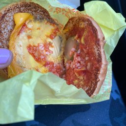 a half eaten pizza in a wrapper a half eaten pizza in a wrapper
