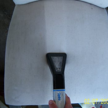 Clean USA Cleaning & Restoration - One of our certified technicians cleaning a soiled chair. - Carpet Cleaning Near Me - Sycamore, Illinois Clean USA Cleaning & Restoration - One of our certified technicians cleaning a soiled chair. - Carpet Cleaning Near Me - Sycamore, Illinois