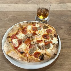 Peel Wood Fired Pizza - Pepperoni, sausage, fresh mozzarella, and shredded mozzarella pizza