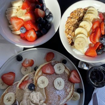 Everyday Eatery - Lemon hotcakes with side of fruit and a granola bowl - Cafes Near Me - Irvine, California Everyday Eatery - Lemon hotcakes with side of fruit and a granola bowl - Cafes Near Me - Irvine, California