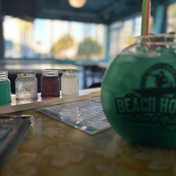 Beach House Bar & Grill - a green drink with a straw - Bars Near Me - Myrtle Beach, South Carolina