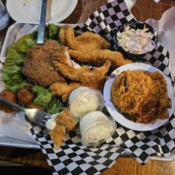 Crab cake and catfish combo! The red rice tastes like Jollof! #Africanisms!!