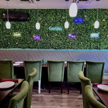 Suma’s Kitchen - a dining area with green chairs and green walls - Pakistani Near Me - Voorhees Township, New Jersey Suma’s Kitchen - a dining area with green chairs and green walls - Pakistani Near Me - Voorhees Township, New Jersey