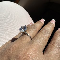 Walt's Jewelers - Stone with crafted ring band and crown.
