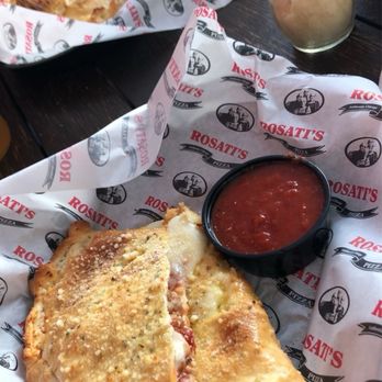 Rosati's Pizza - A Calzone with mushrooms & Italian Sausage served with a side of marinara sauce. - Italian Near Me - Fort Myers, Florida