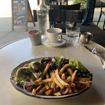Cafe Rue Dix - See .... so good and green ! Loads of salmon under that green Spicey sauce - French Near Me - Brooklyn, New York