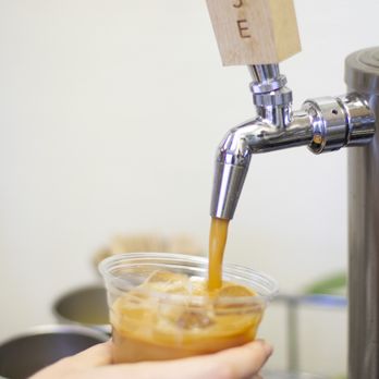 Wild Goose Coffee Roasters - a person pouring a drink - Coffee Roasteries Near Me - Redlands, California Wild Goose Coffee Roasters - a person pouring a drink - Coffee Roasteries Near Me - Redlands, California
